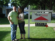 Christopher Kane & Ashley Zenefski with their SOLD sign