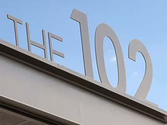 The 102 on Broadway Sign